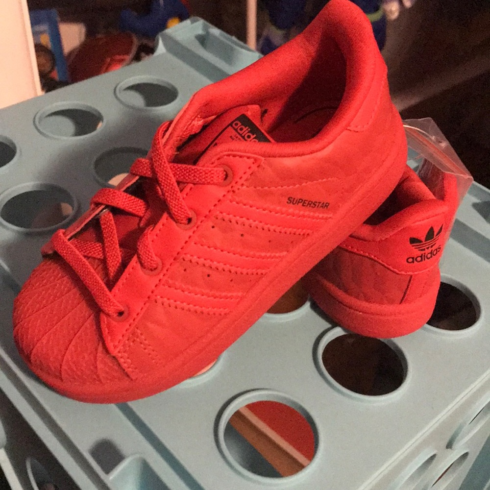 Red adidas ortholite shoes